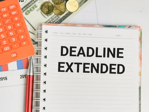 Notebook with deadline extension written on the page